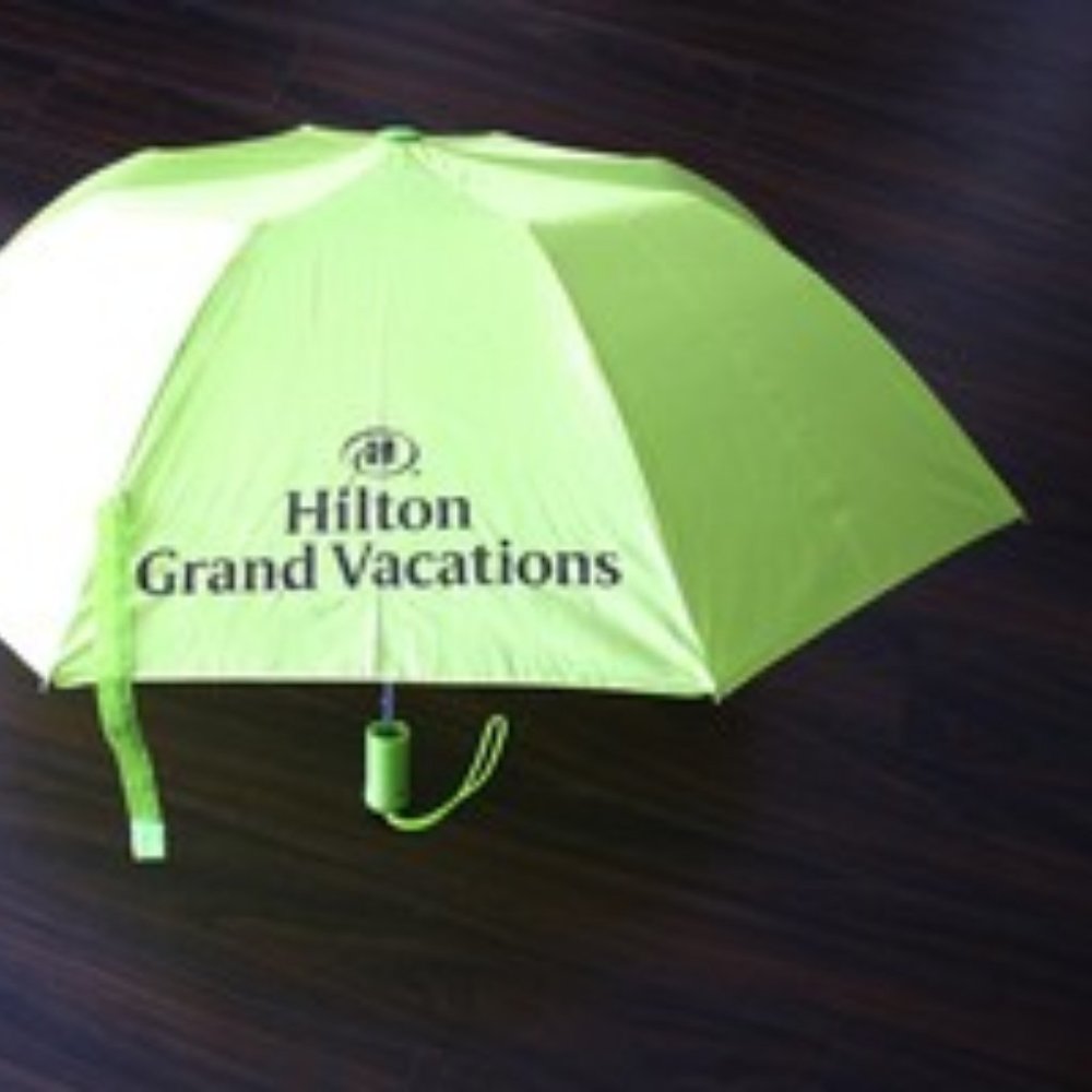 Green Folding Umbrella with Hilton Grand Vacation Logo